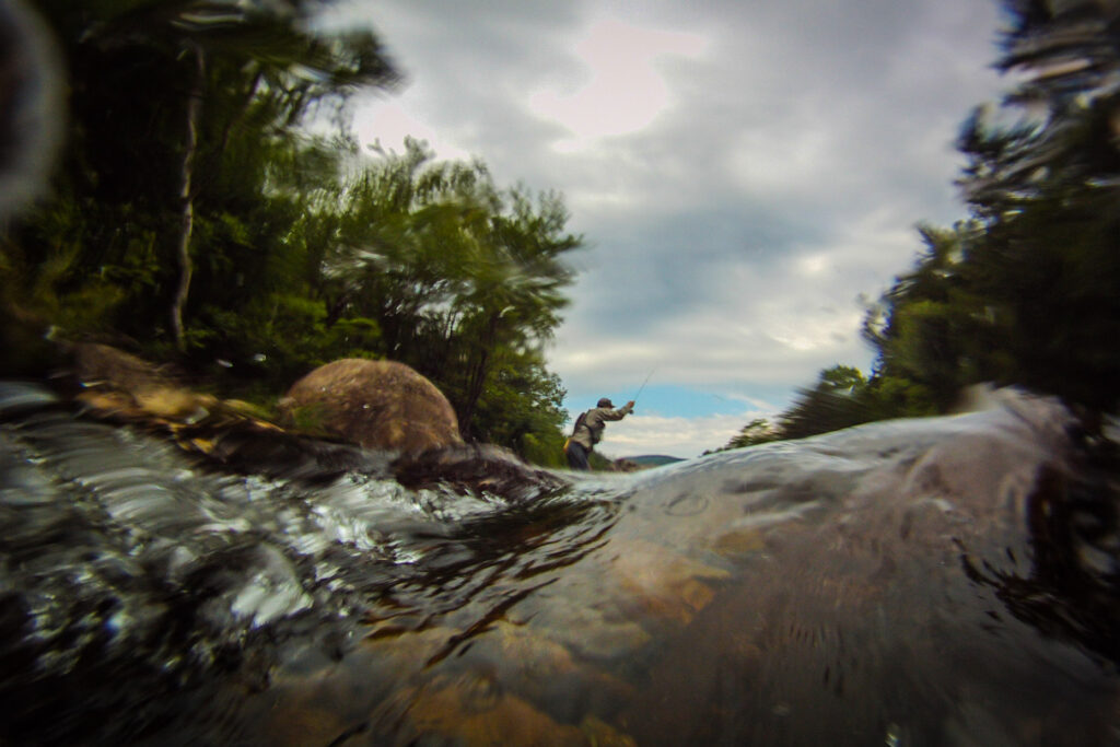 A photograph of fly fishing in New Hampshire, strong photography helps with non-profit storytelling.