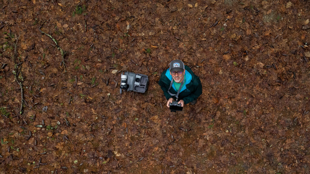 Aerial view from a drone of Joe Klementovich piloting a drone during an editorial photography project