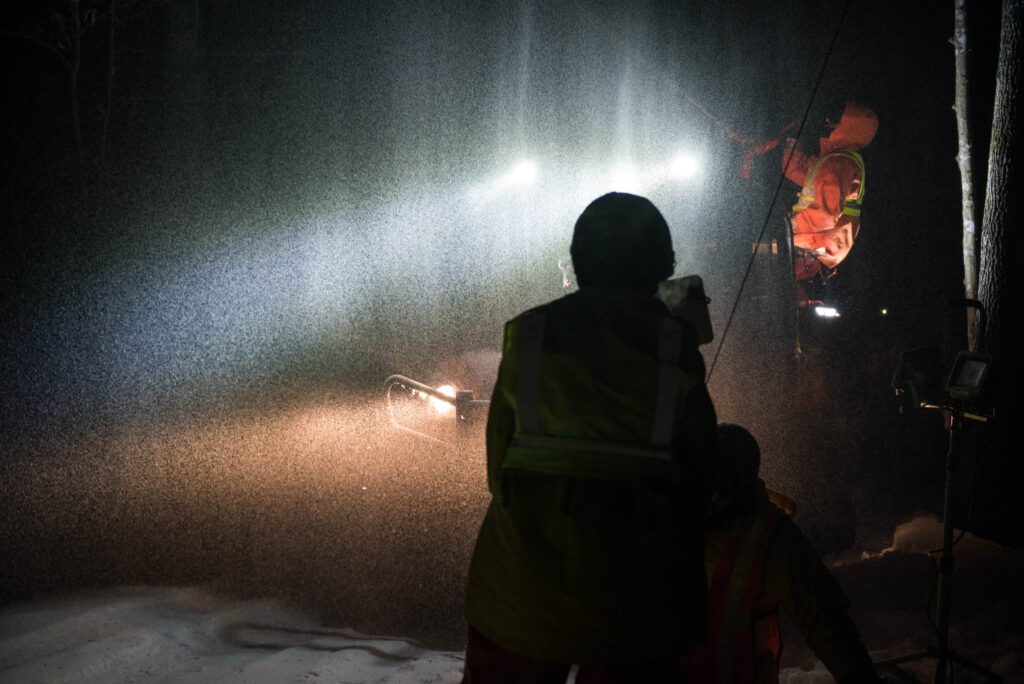 Researchers and technicians spraying water into the forest during the Ice Storm Experiment at Hubbard Brook Experimental Forest