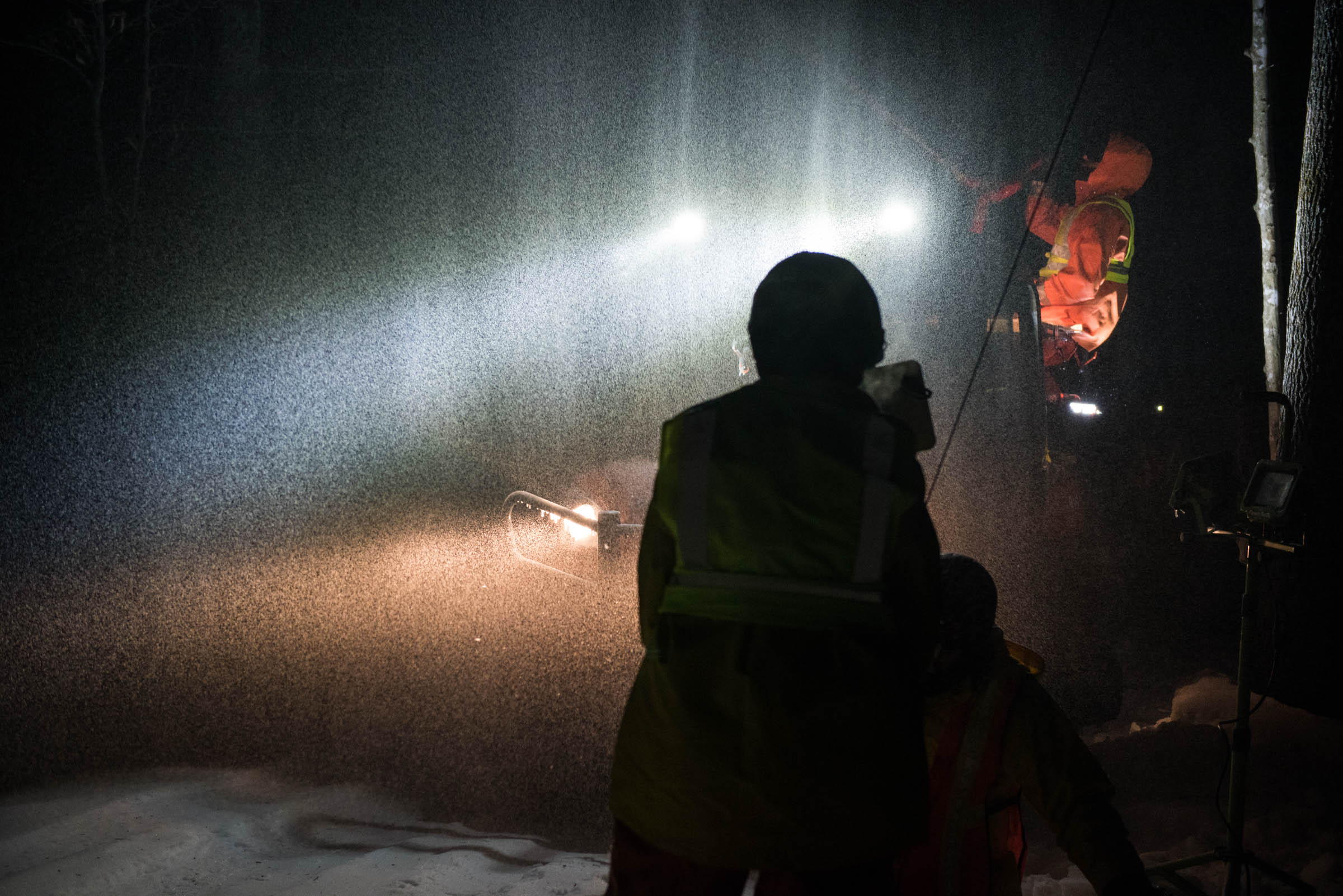 Researchers spraying water into the forest canopy to re-create an Ice storm.